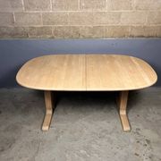 Oval extendable dining table in beech with Danish design.