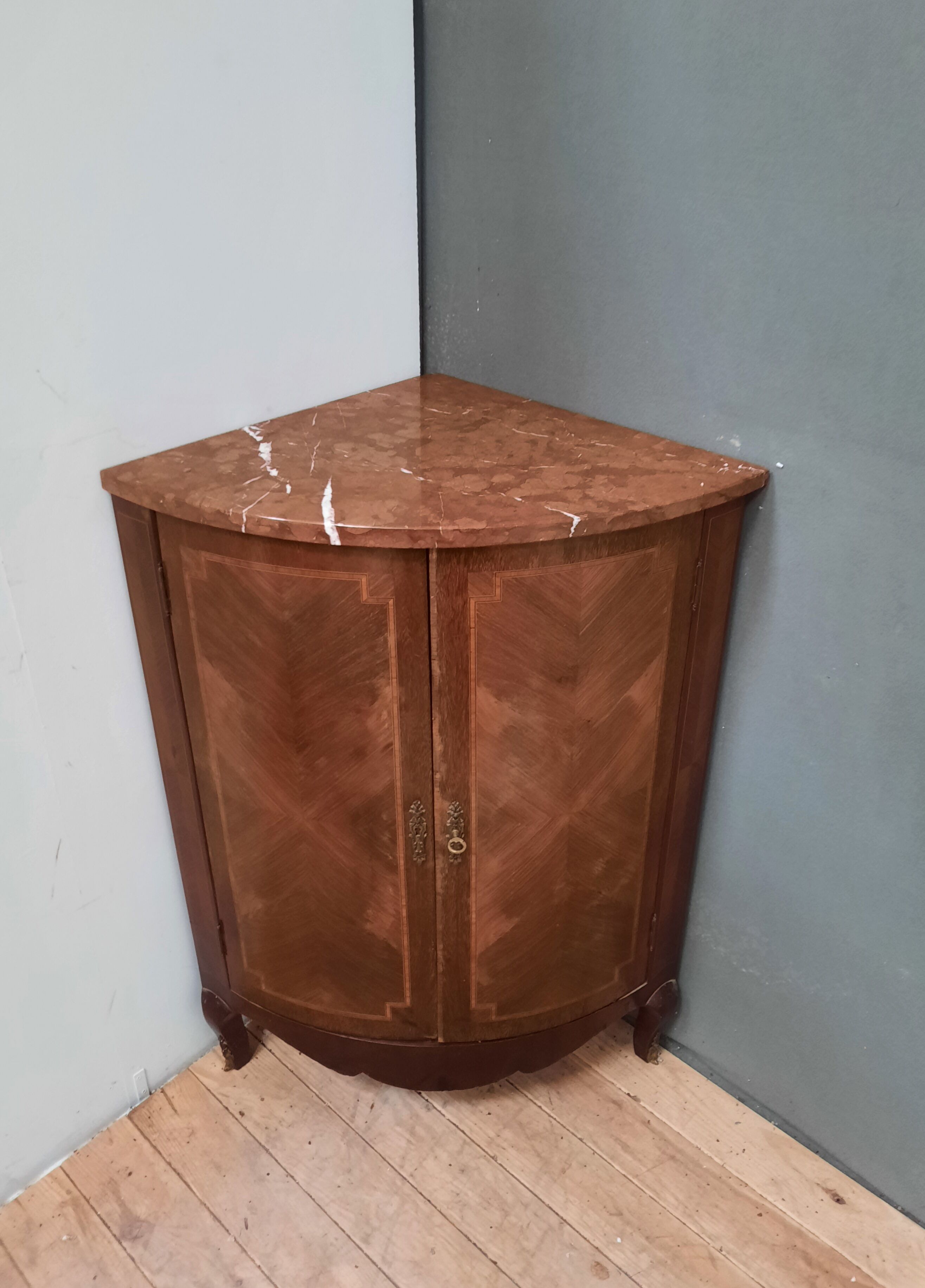 Corner cabinet with marble top