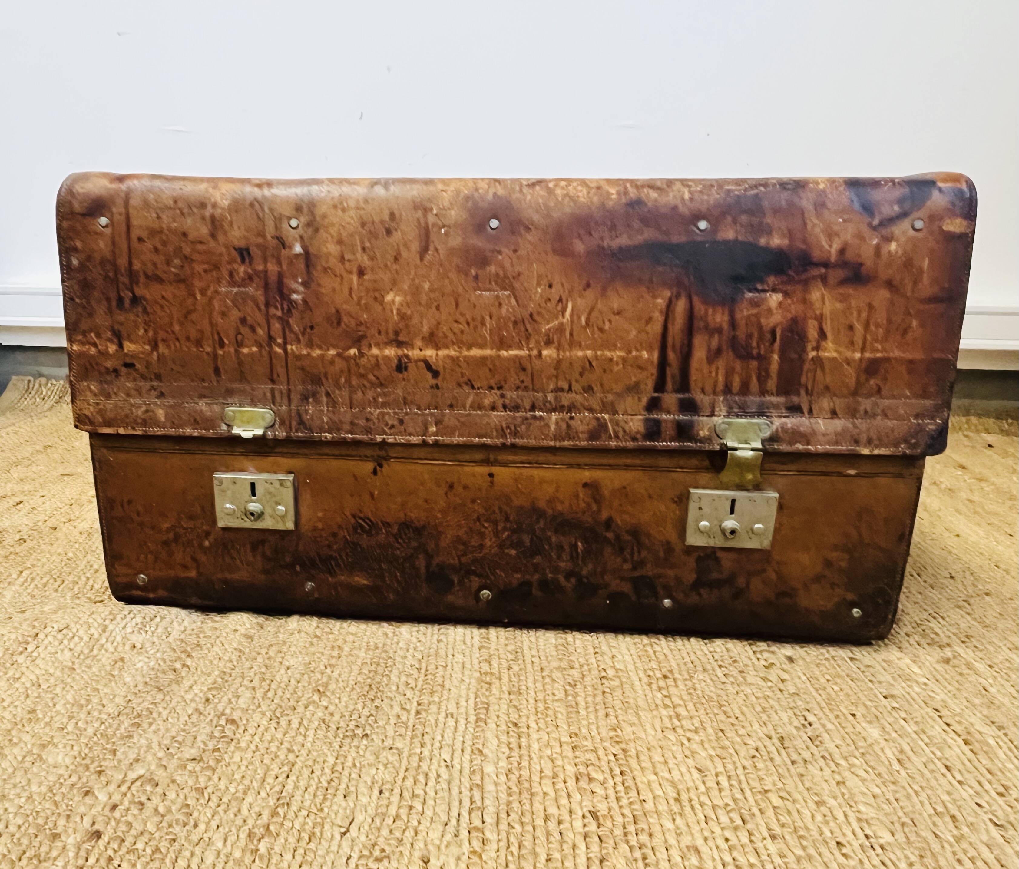 Large Gustave Keller leather trunk with multiple compartments