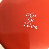 Red pitcher in enamelled metal