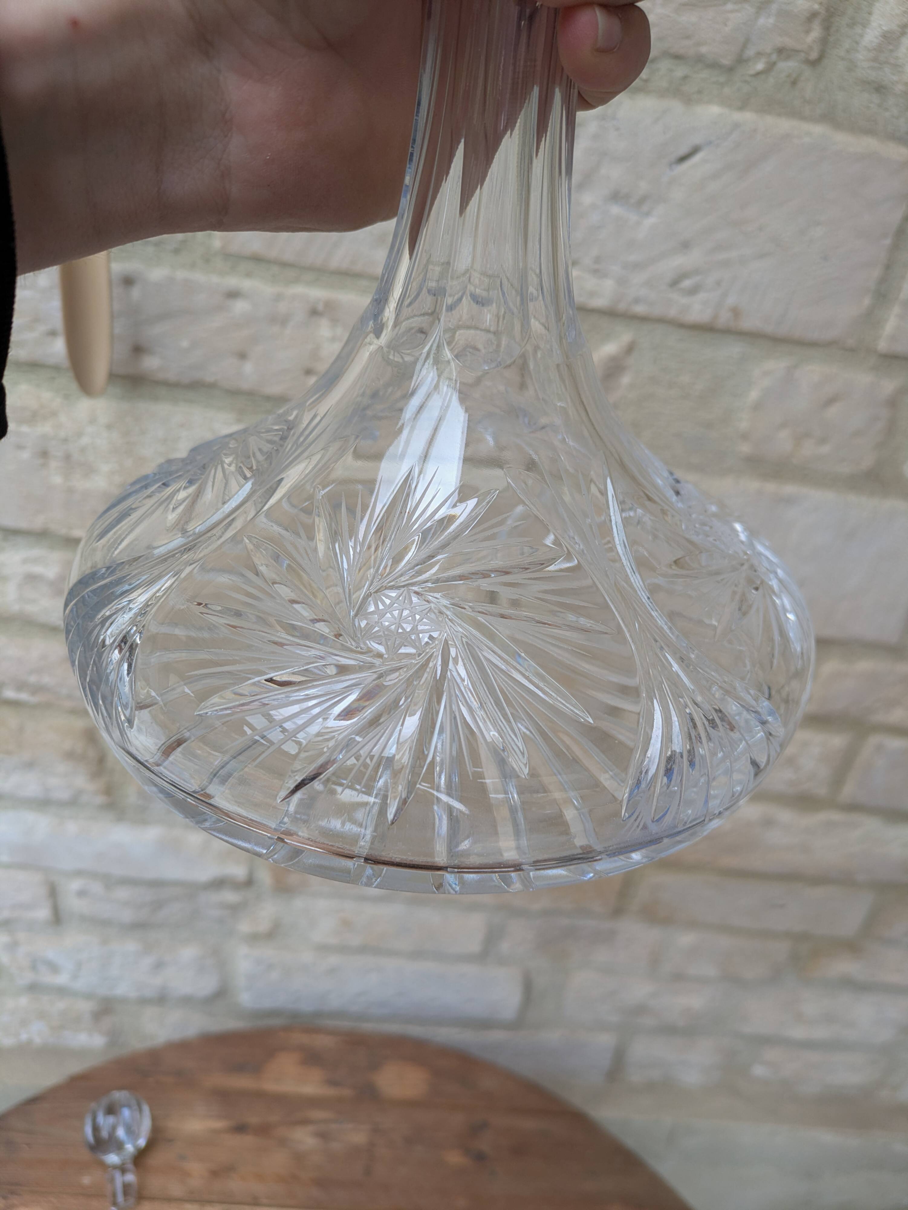 Antique cut crystal decanter with stopper.