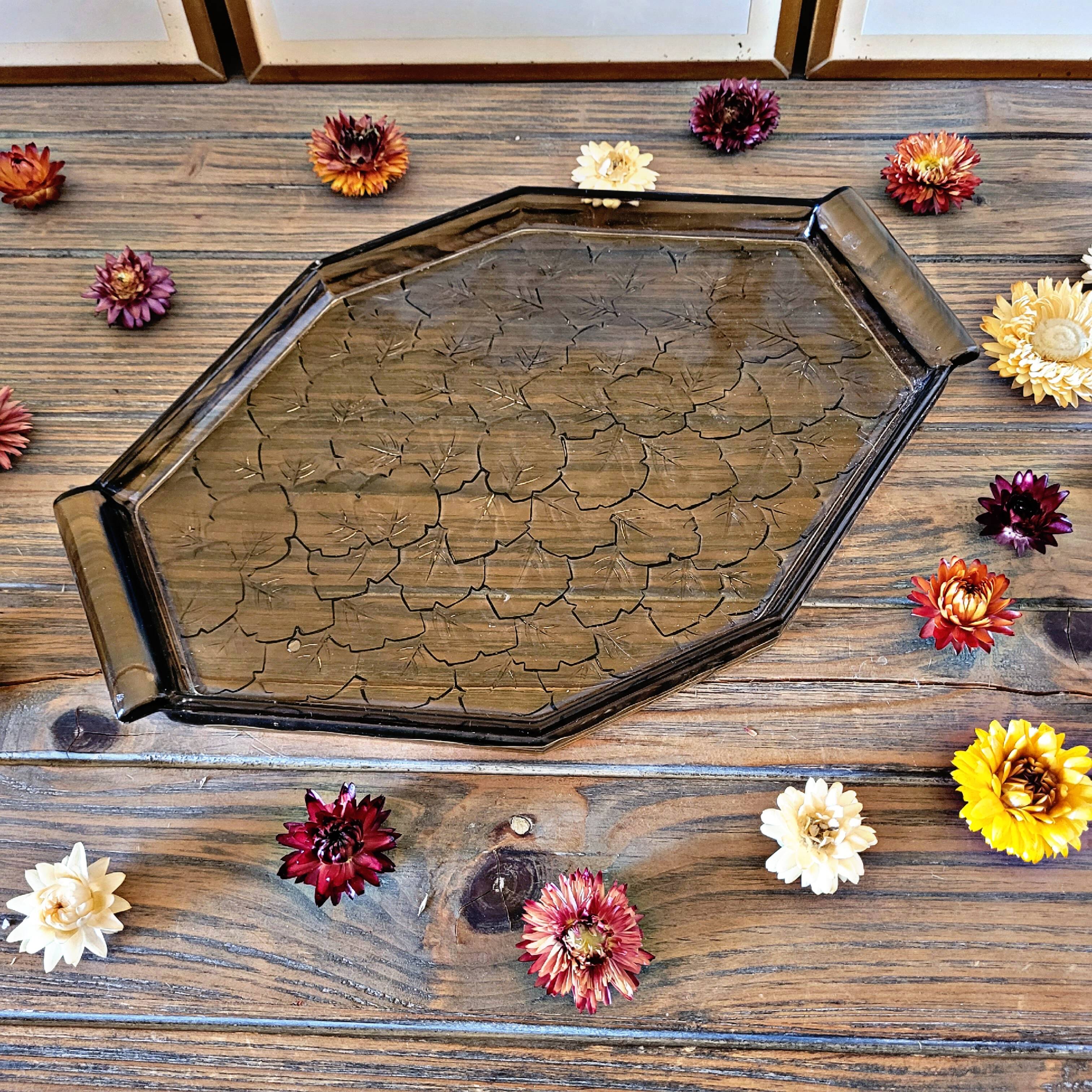 Art deco style black glass tray decorated with leaves