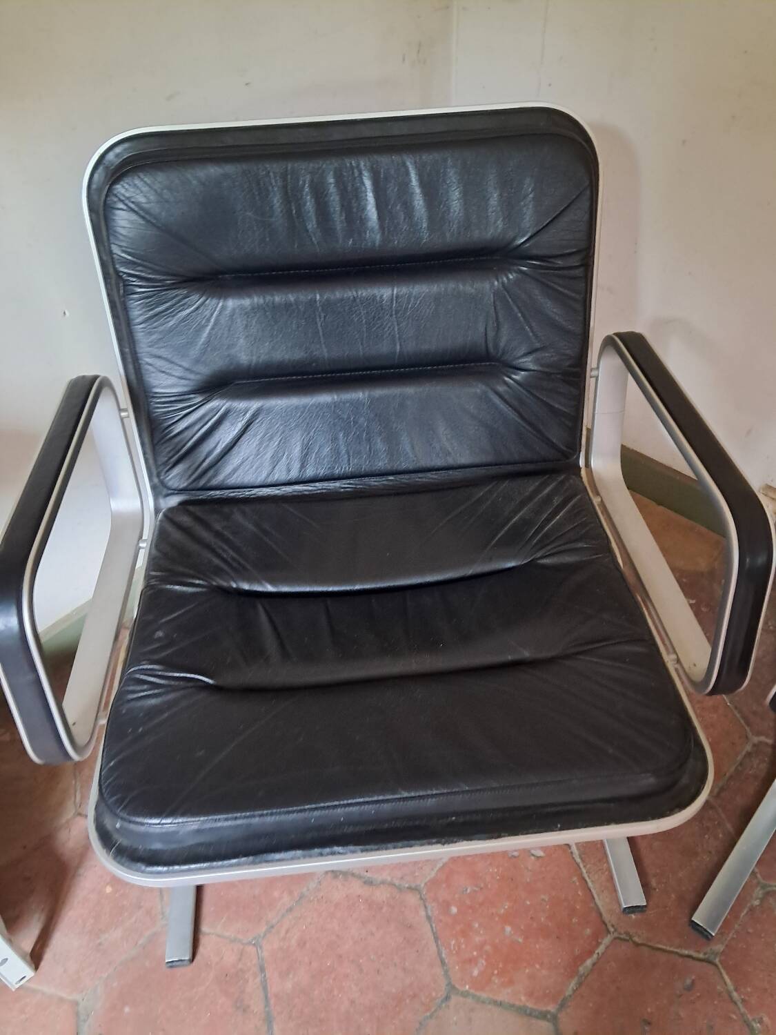 Pair of leather and aluminum armchairs