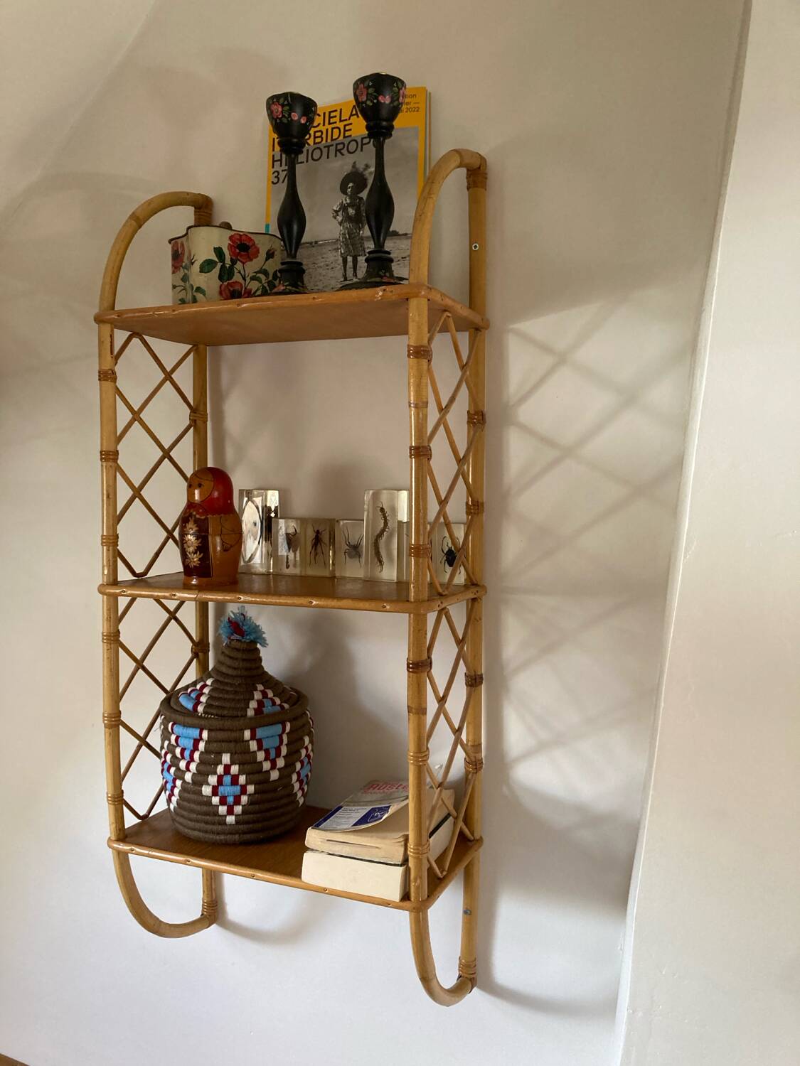 Vintage vertical wall mounted rattan shelf