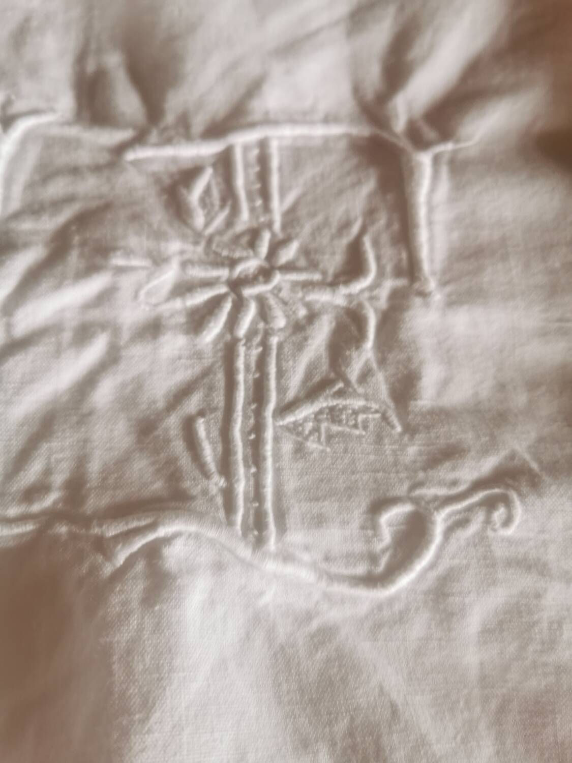 Old large monogrammed sheet hand-embroidered.