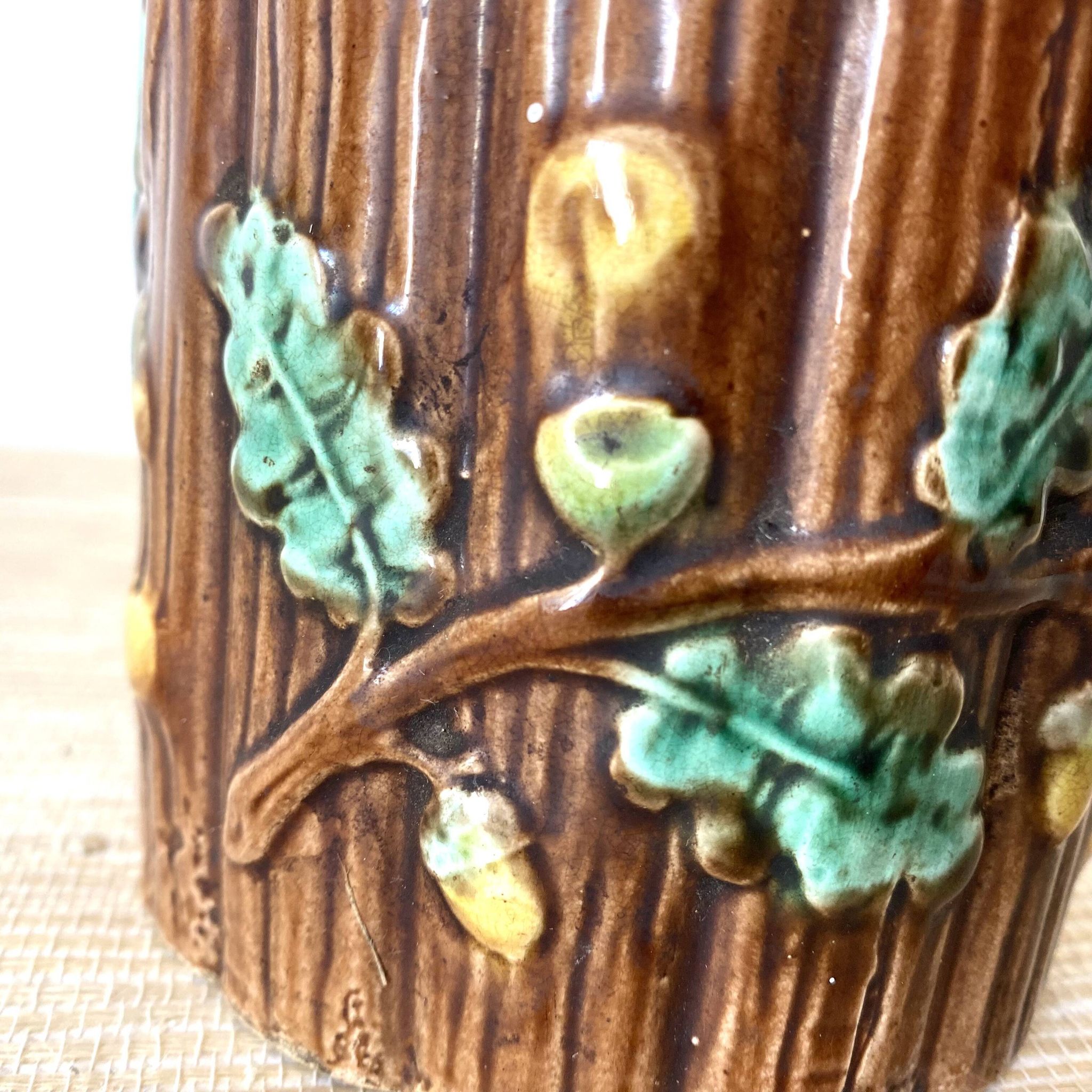 Antique slip pot with acorn decoration