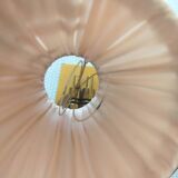 Vintage wall sconces in brass with pleated fabric shades.