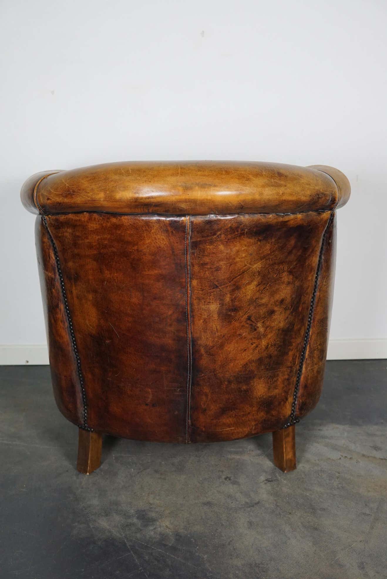 Vintage club armchair in leather color cognac Netherlands