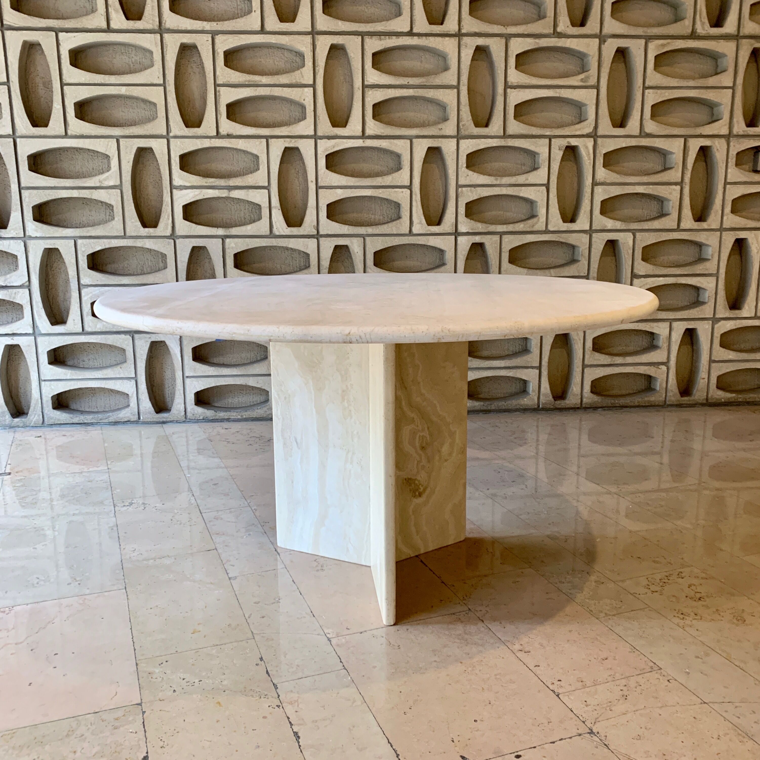 Round travertine dining table
