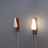 Danish wall lights from the 1970s, made of milky white glass shades, teak wood suspension and brass.