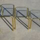 Nested table in gold metal and glass