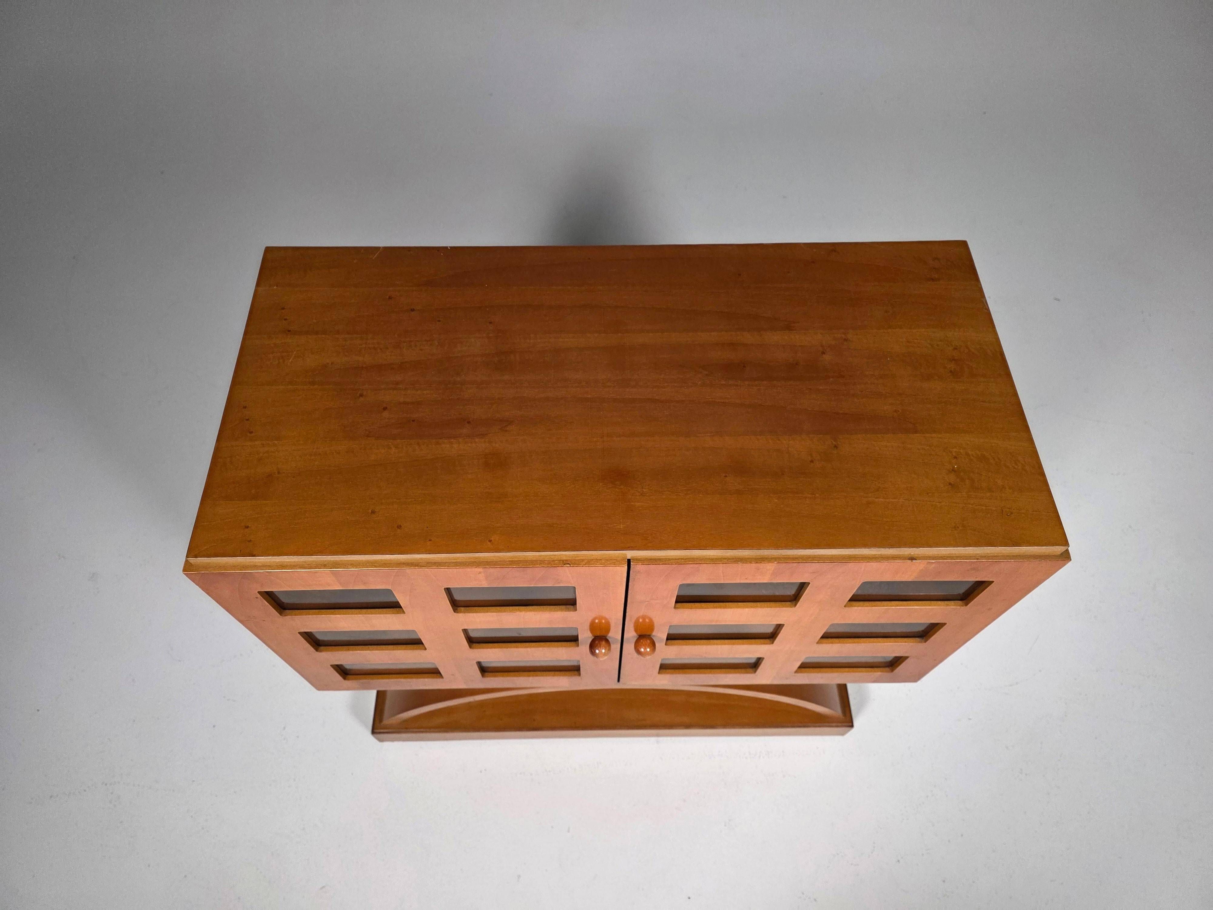 Mid-century modern mobile bar cabinet with sculptural base, 1950s.