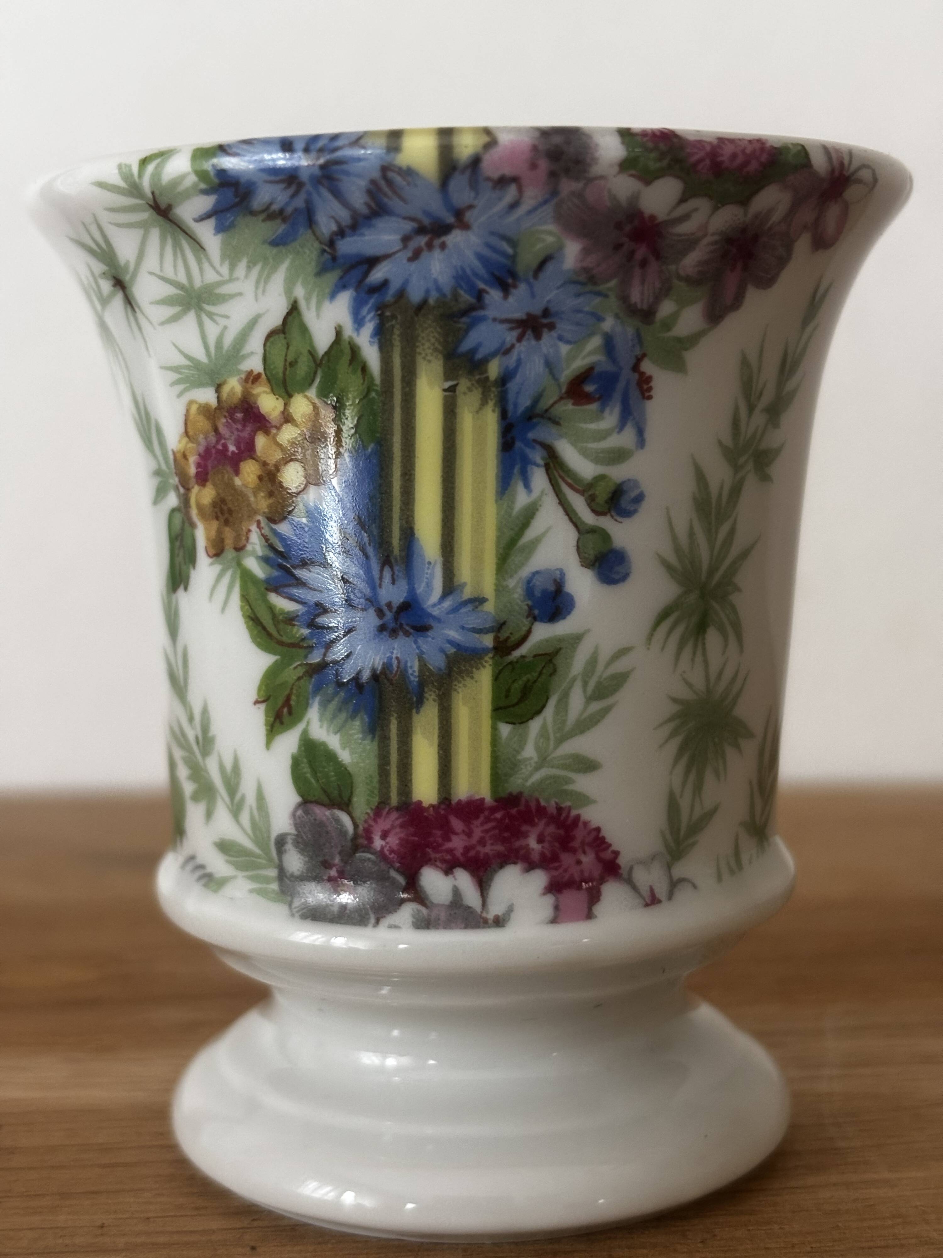 Adorable small porcelain vase from Paris with floral decoration.