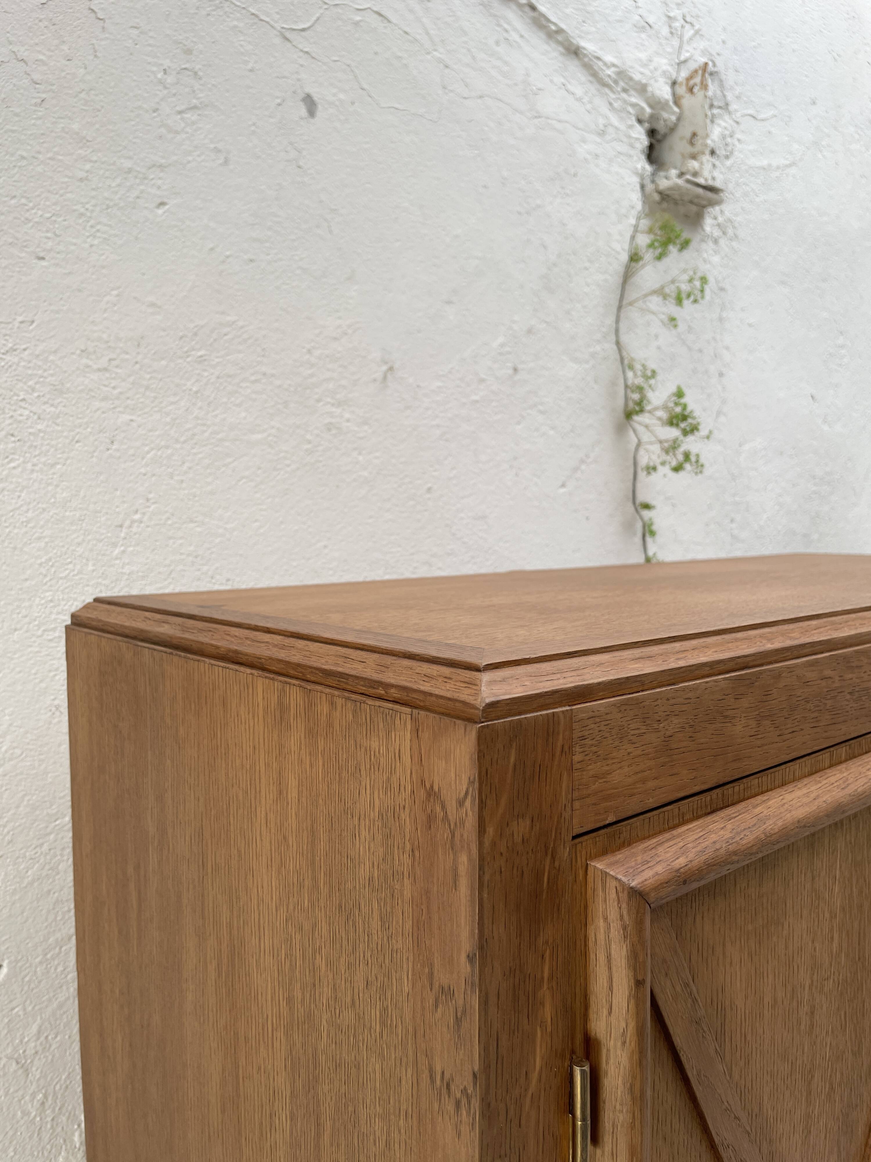 Storage unit in solid oak and veneer, circa 1960.