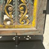 Rectangular Indonesian construction element with blue and yellow plant in carved wood