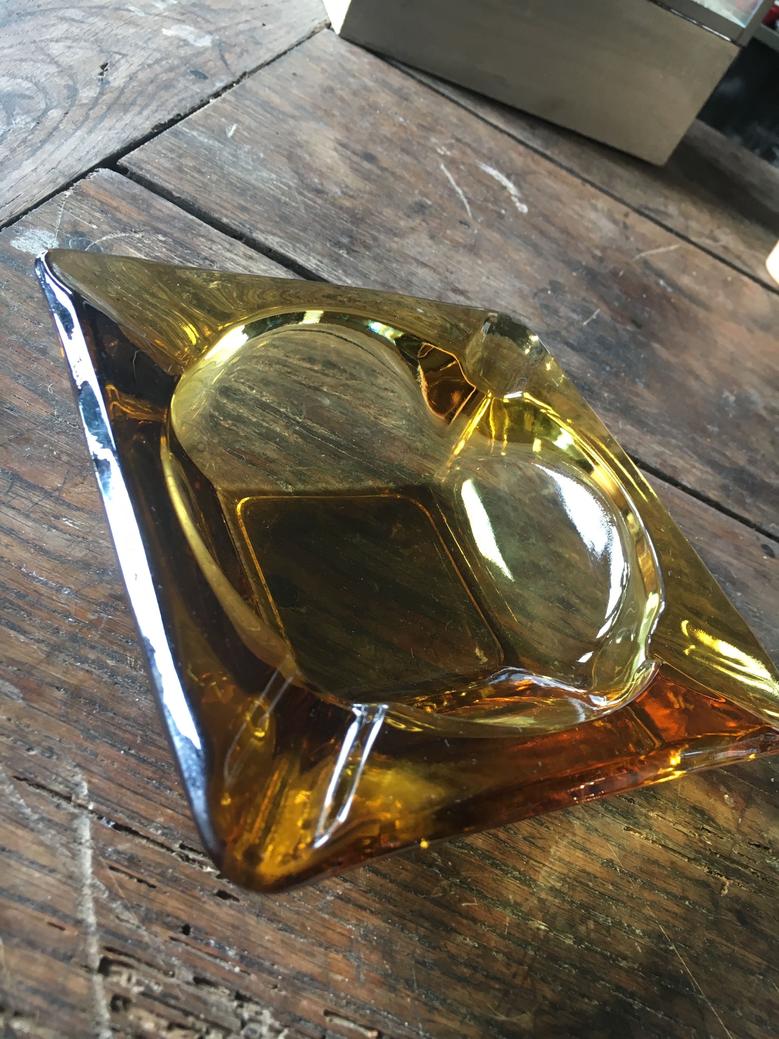 Vintage ashtray in amber glass