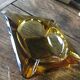 Vintage ashtray in amber glass