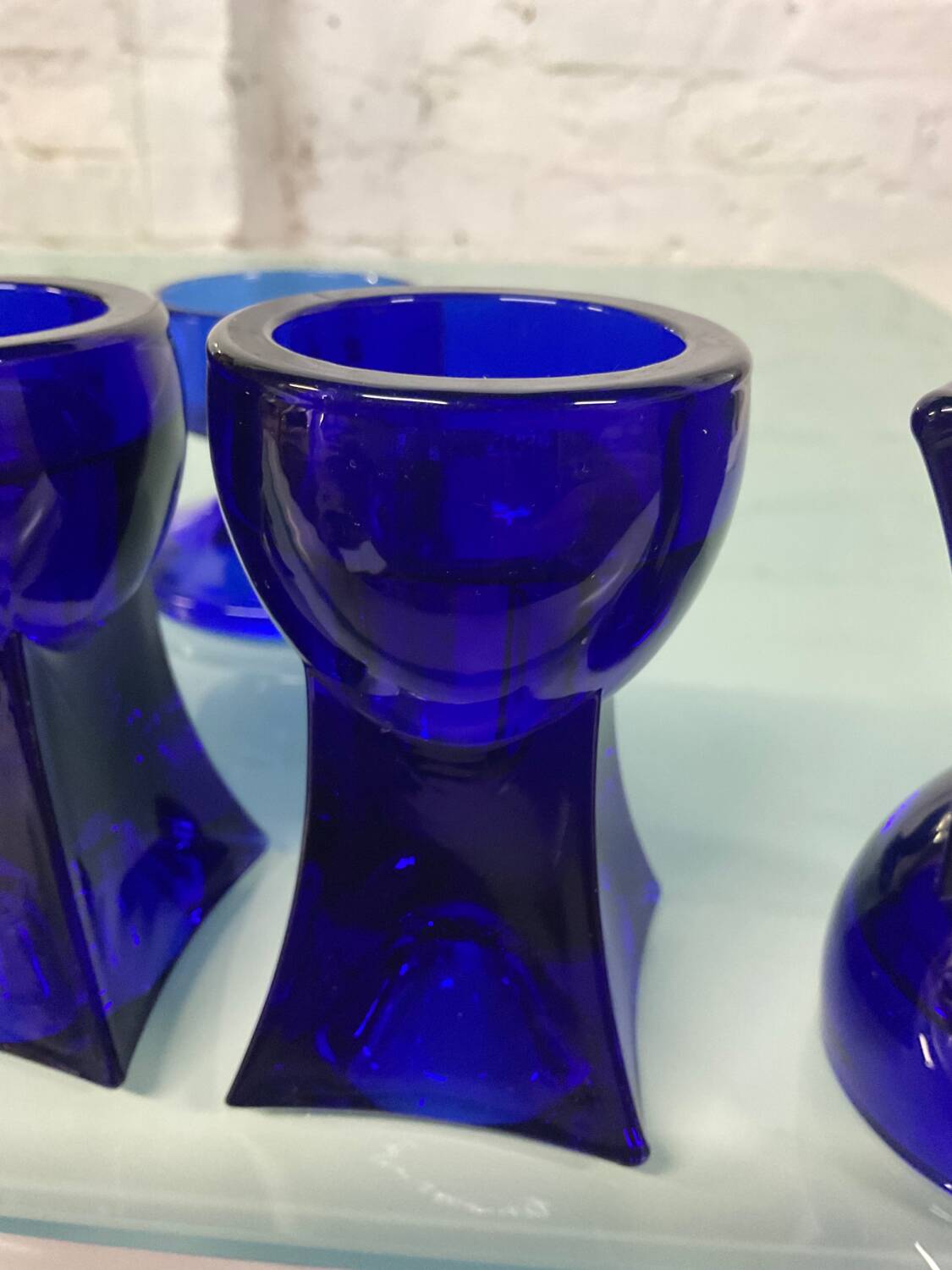 Set of 7 vintage cobalt blue glass footed candlesticks