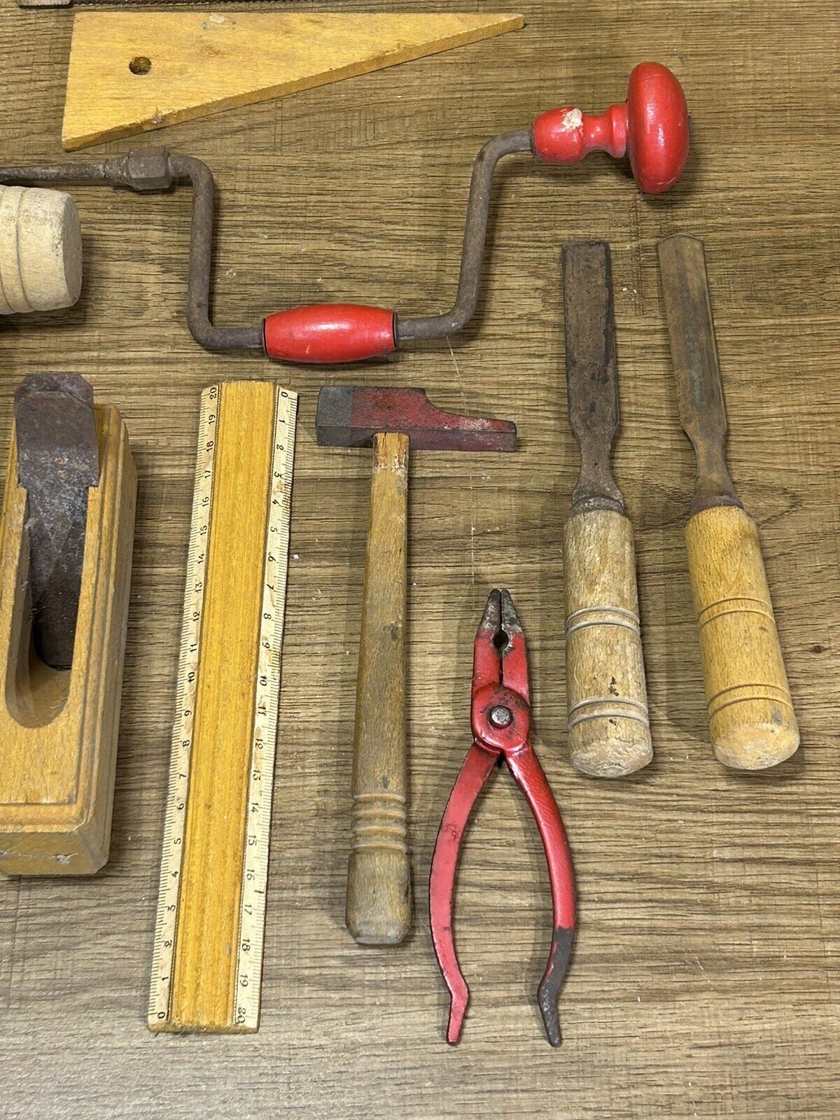 lot of antique toys, carpentry tools, wood, saw, plane, hammer,...