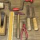lot of antique toys, carpentry tools, wood, saw, plane, hammer,...