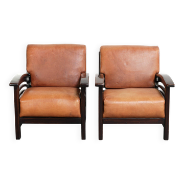 Set of 2 cognac-coloured cow leather Art Deco armchairs from 20th century
