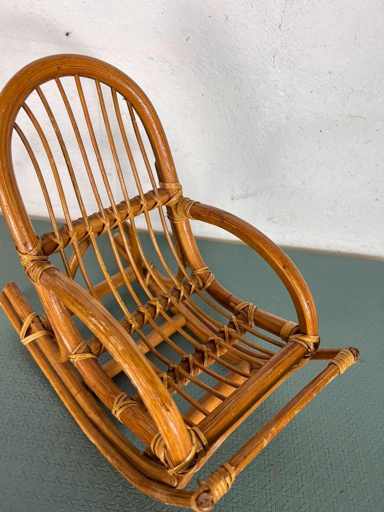 Vintage doll rocking chair in rattan