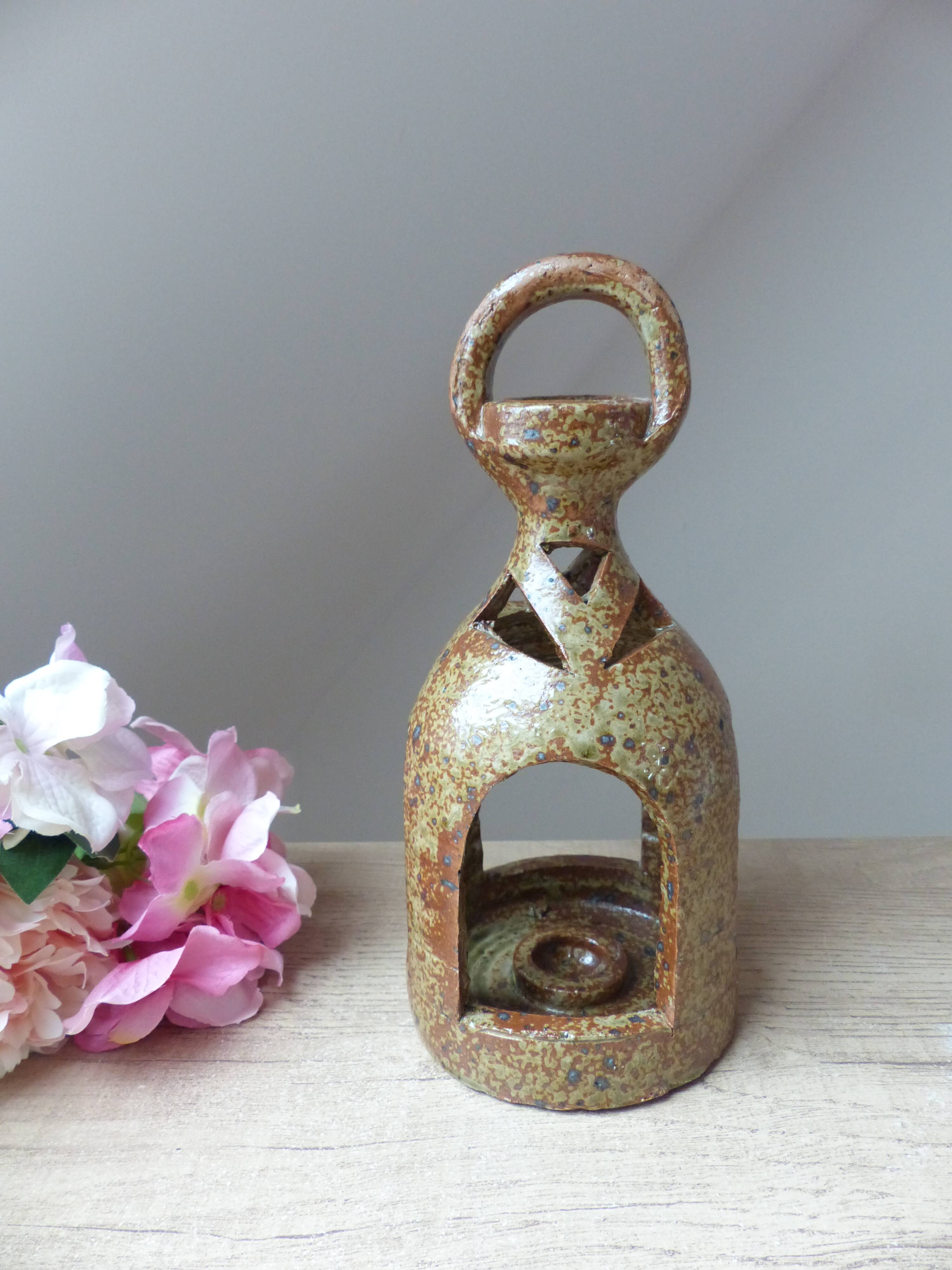 Old candle holder lantern in pyrite sandstone, decorative lantern
