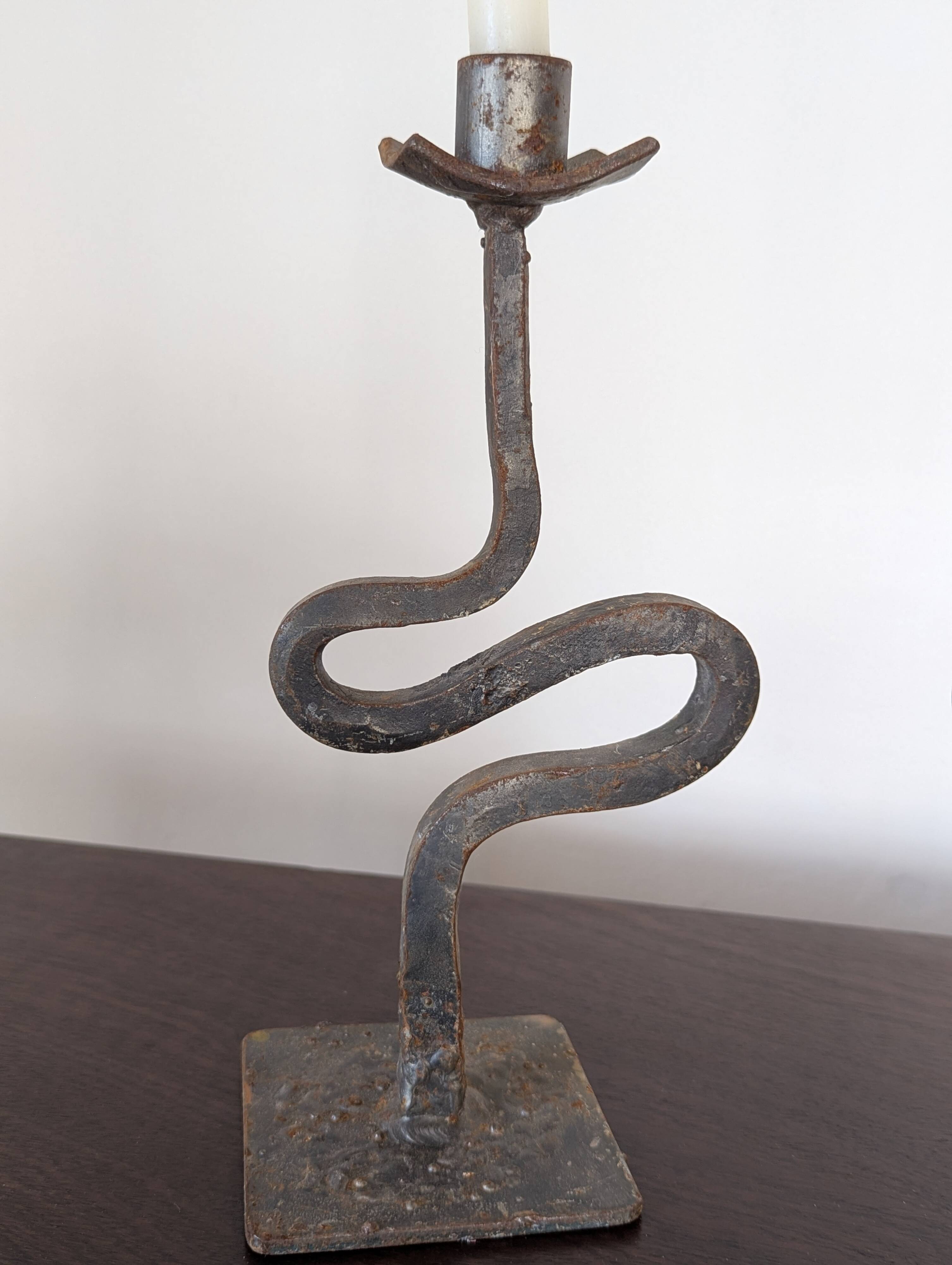Pair of wrought iron candlesticks