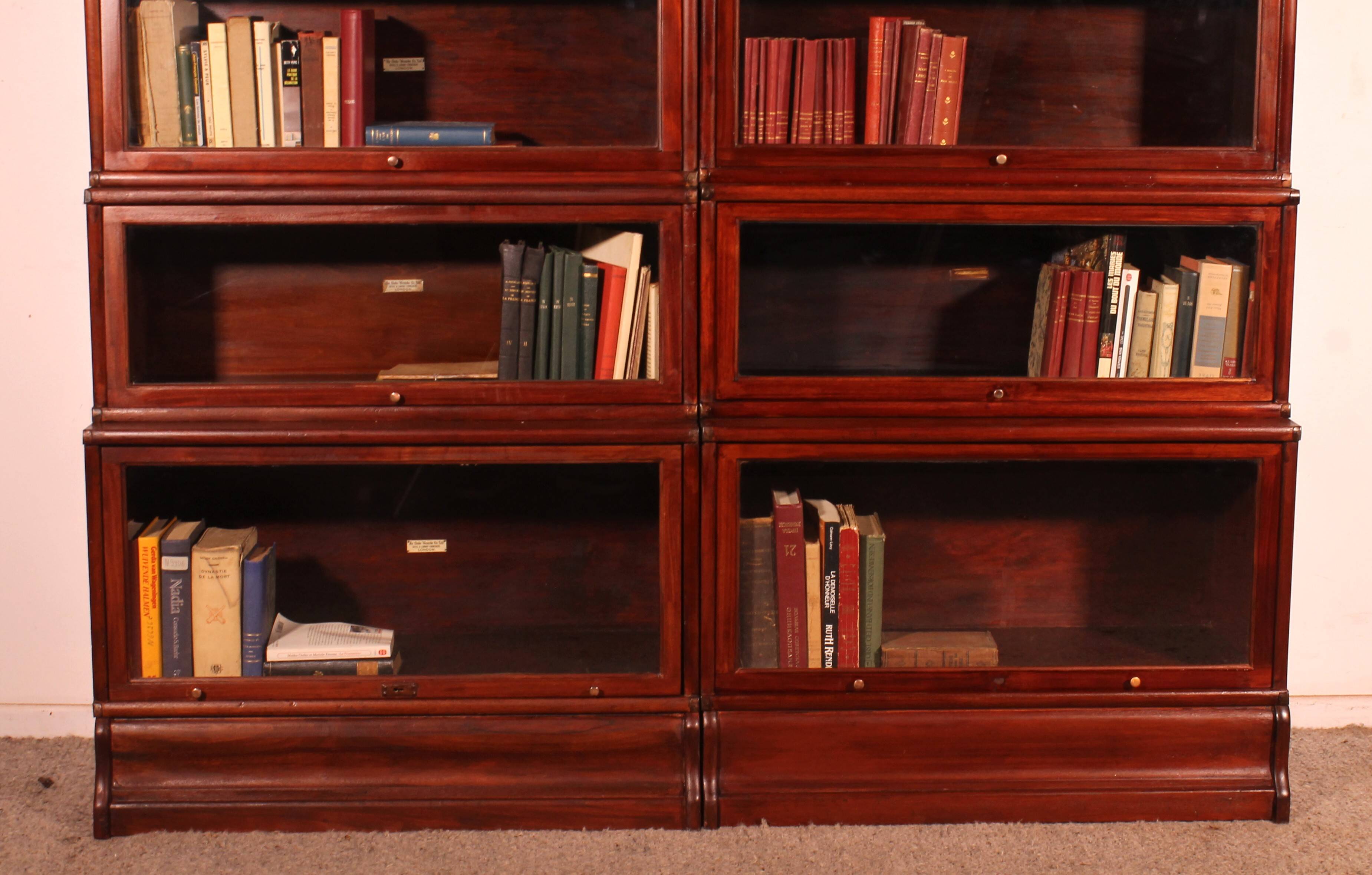 pair of Globe Wernicke London 'waterfall' bookcases in mahogany circa