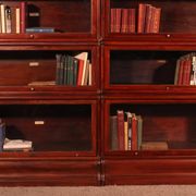 pair of Globe Wernicke London 'waterfall' bookcases in mahogany circa