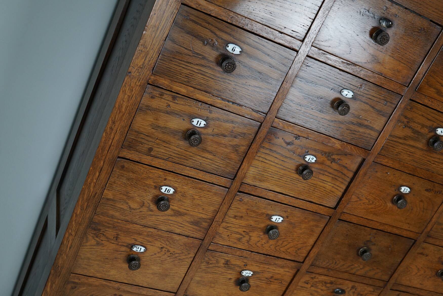 Large dutch oak apothecary cabinet / barber cabinet with enamel shields, 1900s