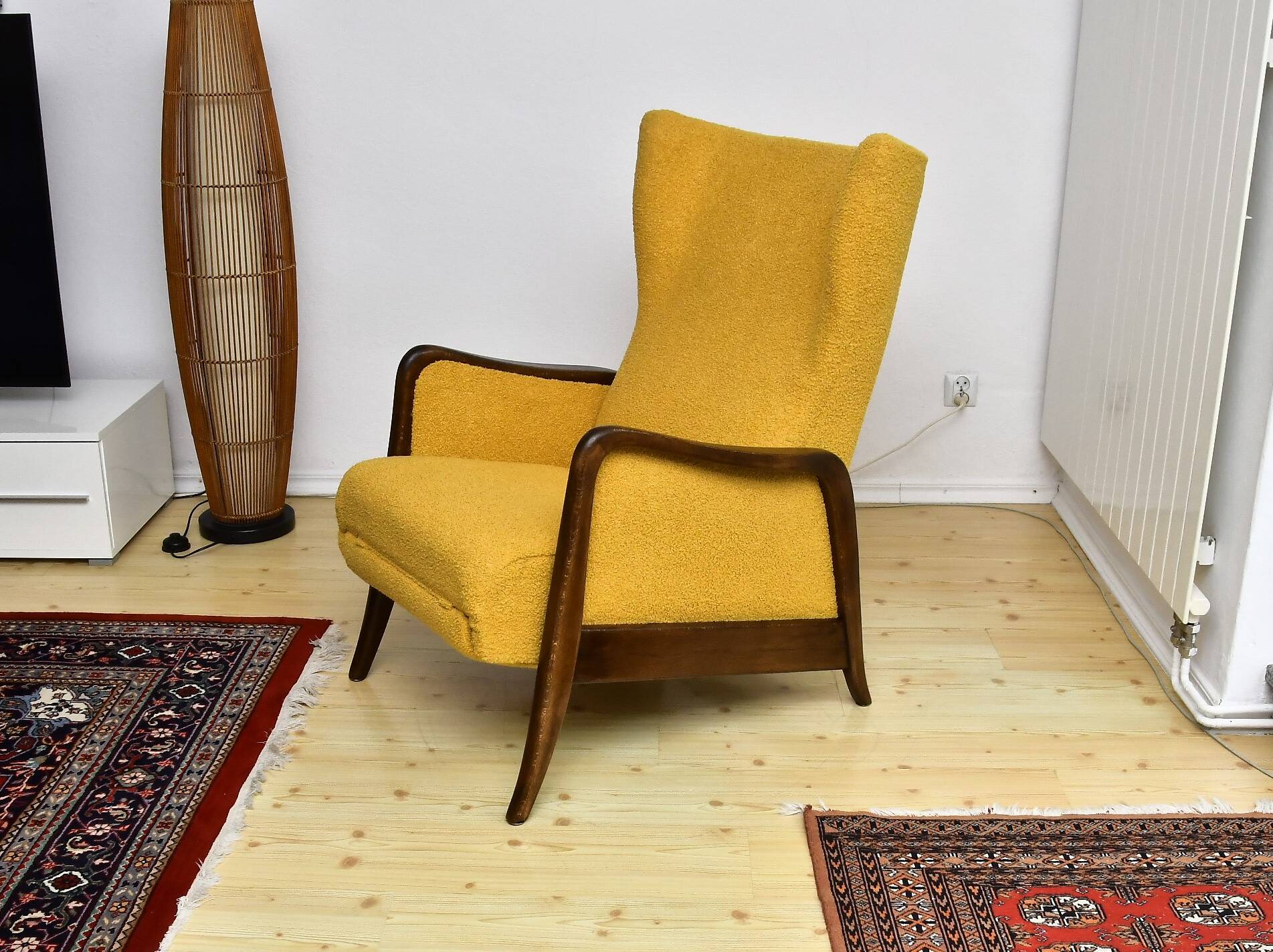 Yellow boucle wingback chair with folding footstool, 1950s