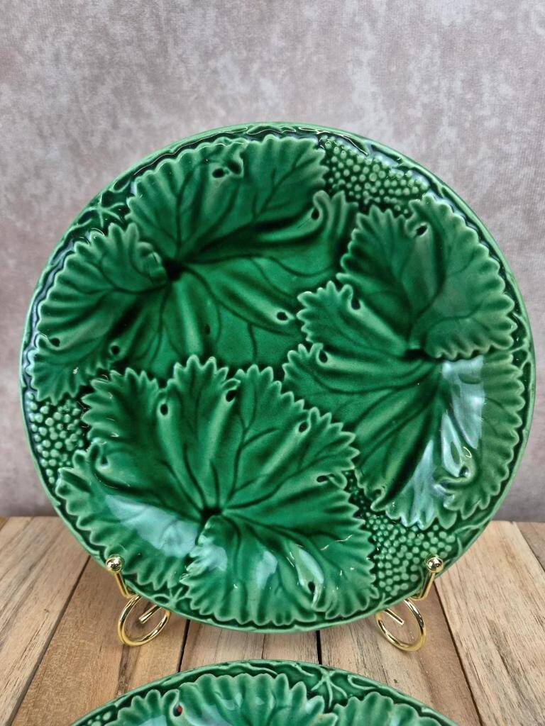 Set of 2 green earthenware dessert plates with vine decoration.