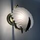 Pair of shell wall lights in glass and gold-plated metal. 1980s