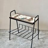 Vintage magazine table with Greek mythology motif.