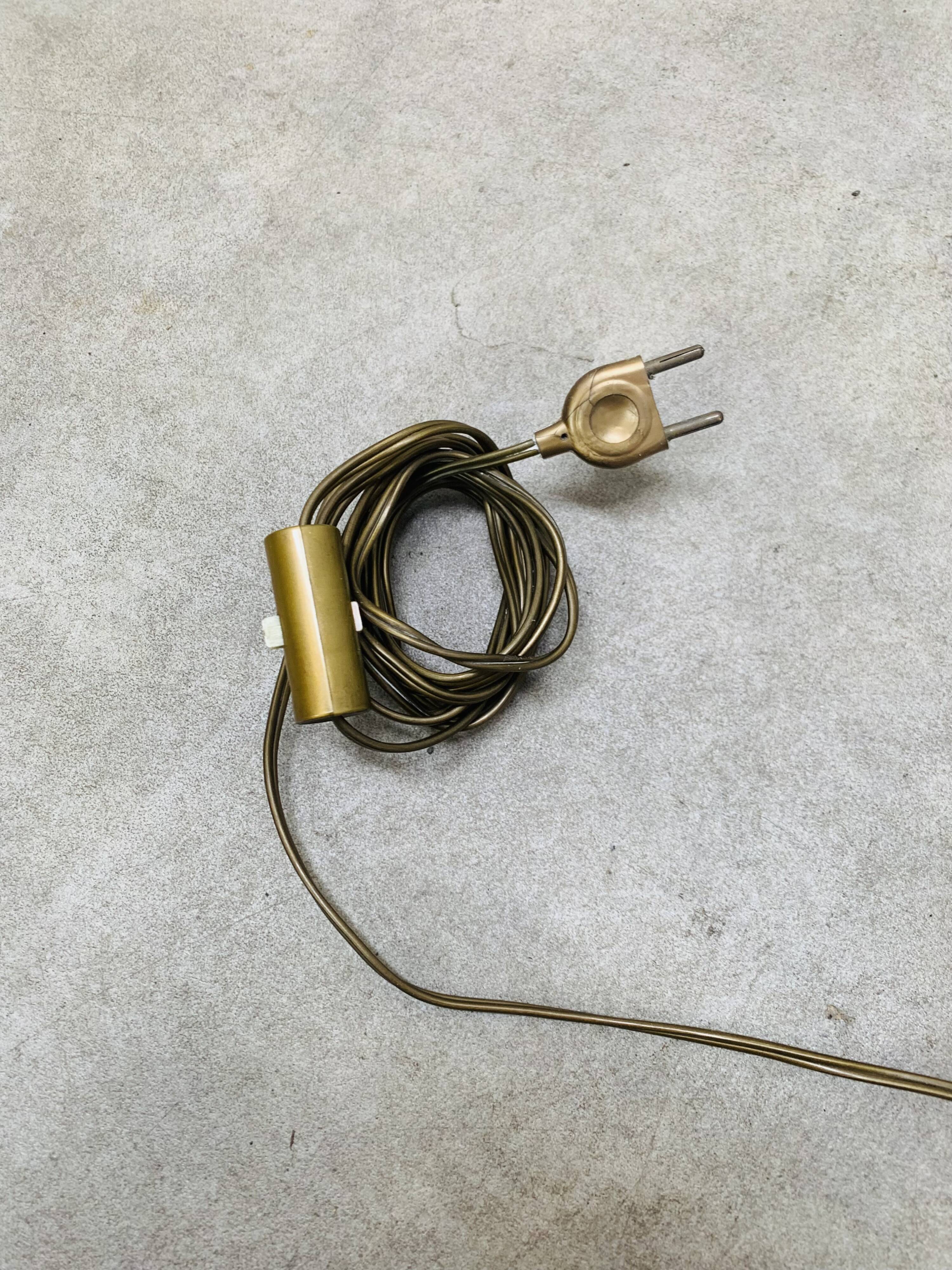 1950s tripod floor lamp, brass and black metal