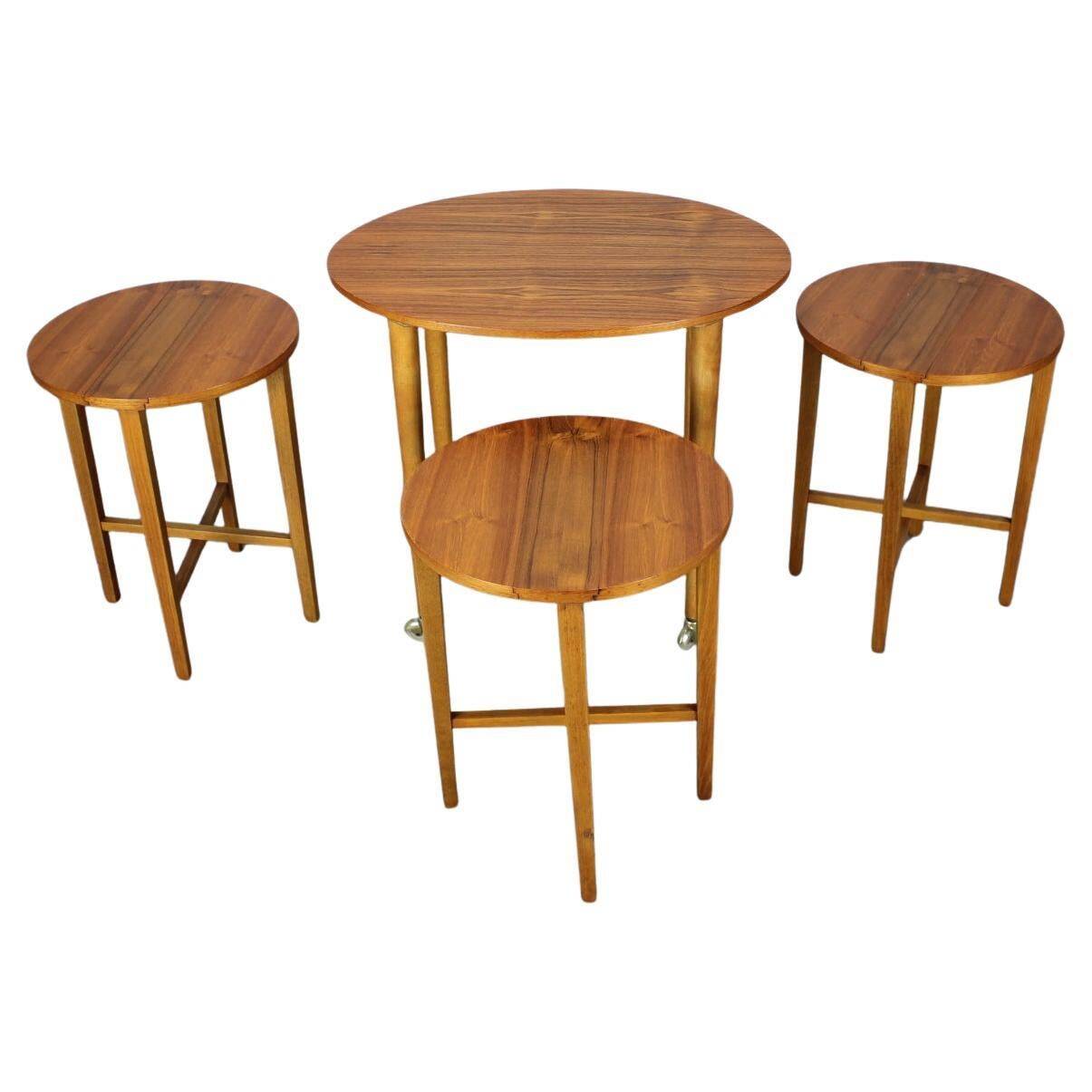 Restored Danish folding teak table with three nesting chairs by Poul Hundevad