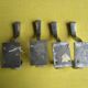 Set of four aluminium coat hooks from the 1950s.