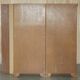 Corner library made of flamed hardwood, in 3 parts.