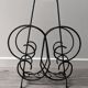 Vintage wrought iron magazine rack