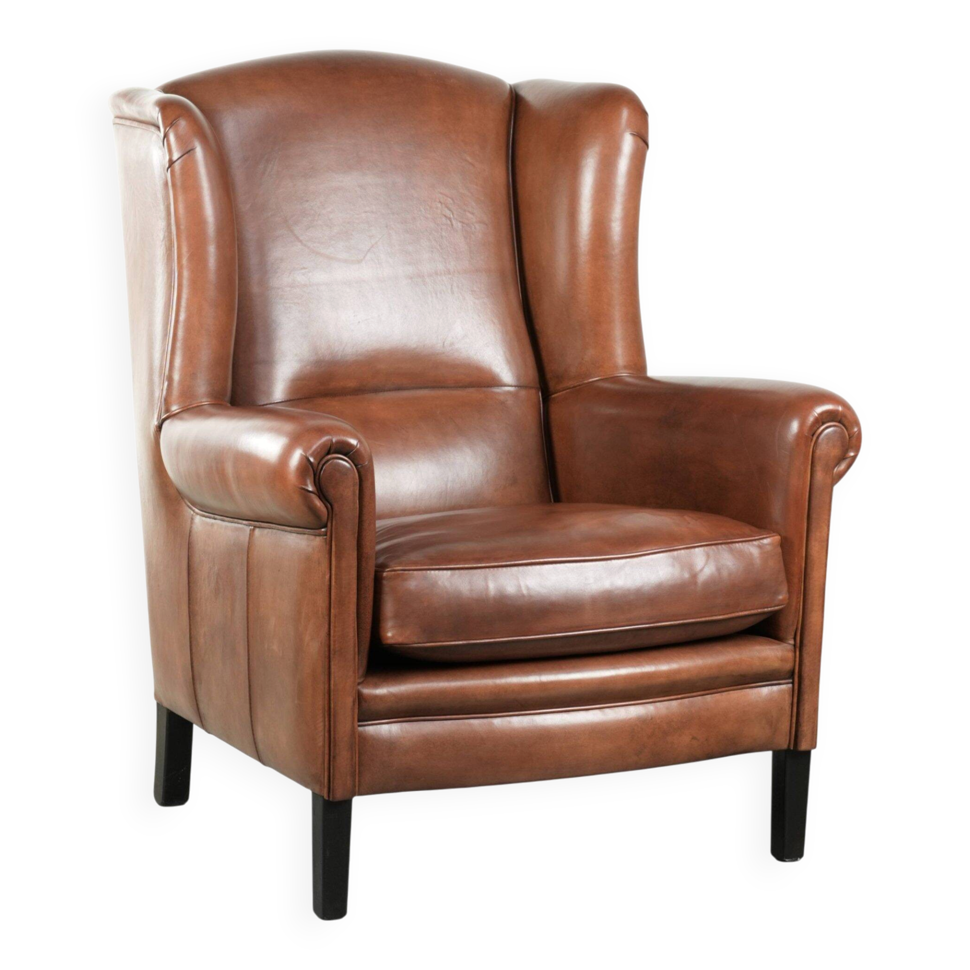 Large sheepskin wingback armchair in timeless English style