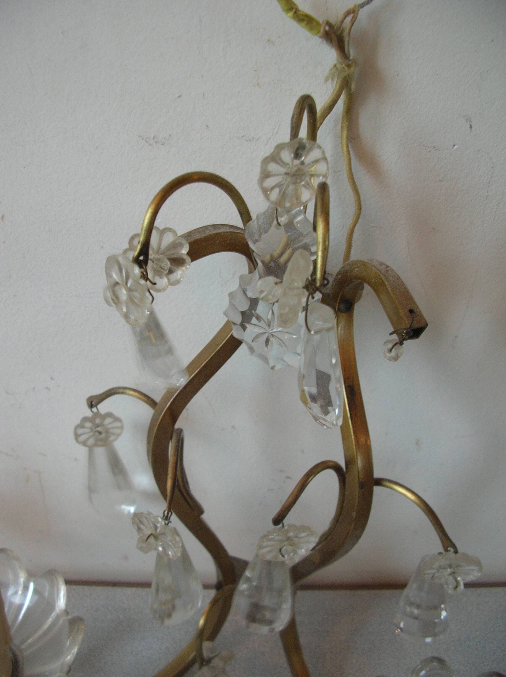 Old pair of double lamp lights with glass and brass pendants, retro decoration