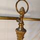 Old golden brass towel rack on baroque style foot