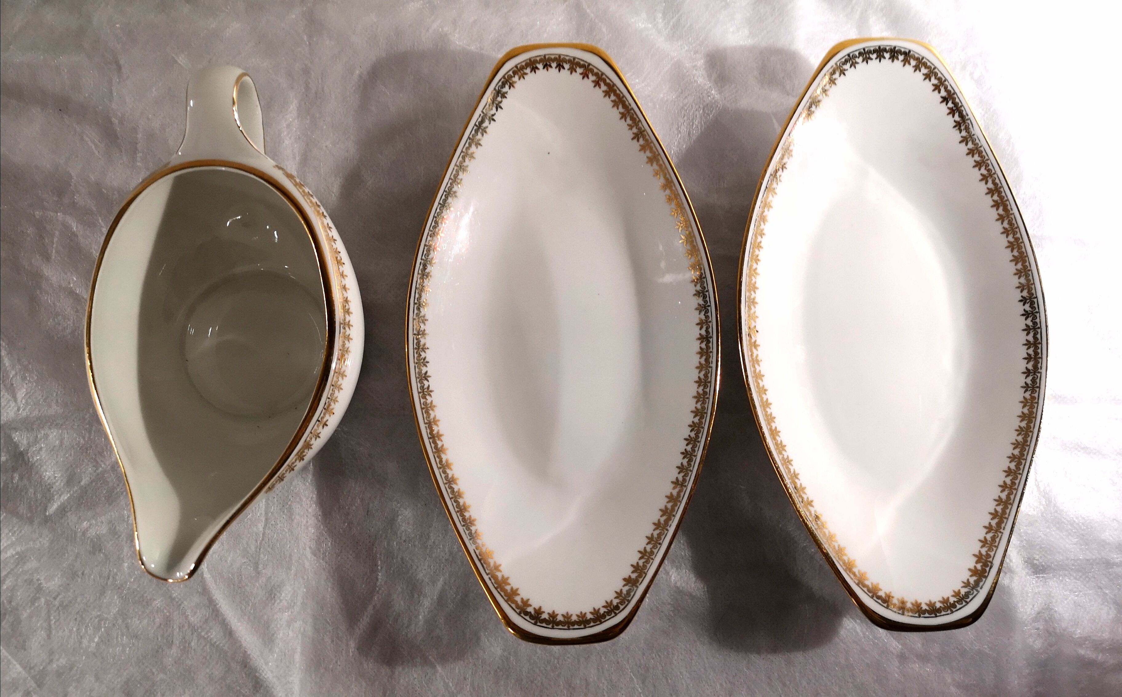 Gravy boat and dishes with gold decoration