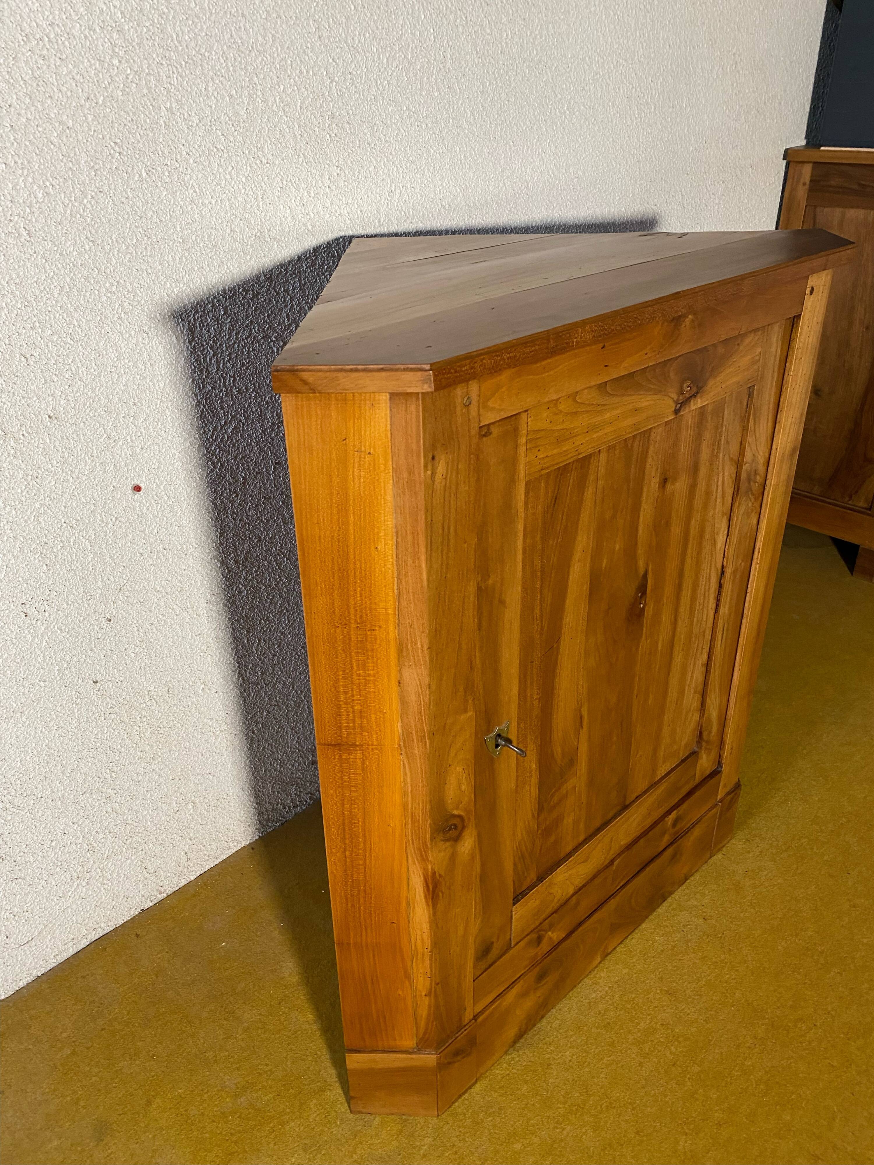 Cherry wood corner cupboard.