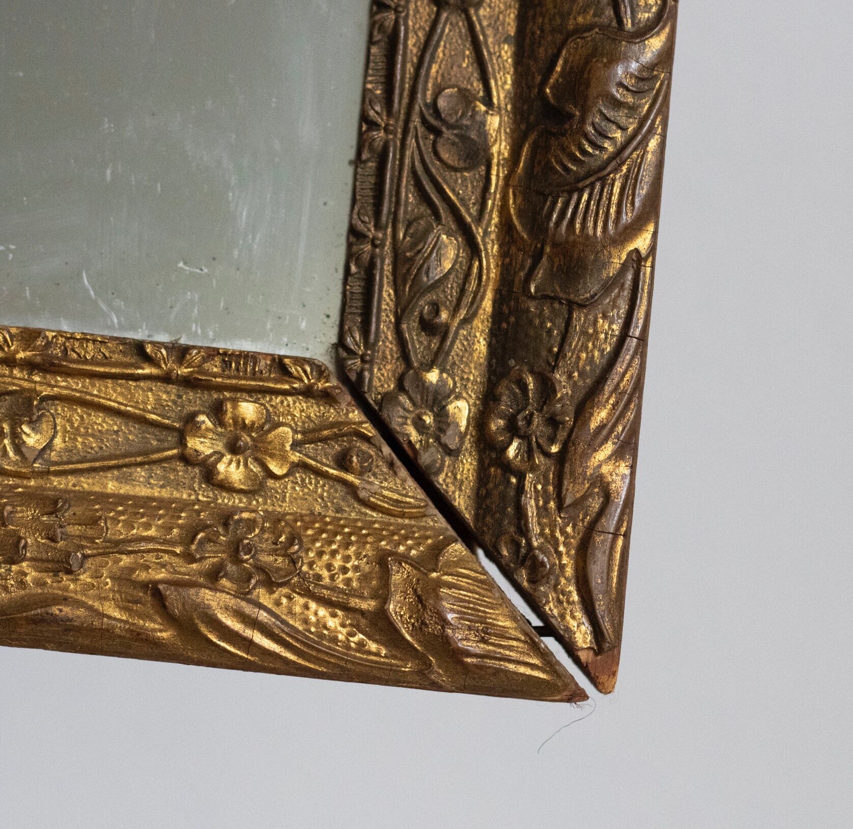 Antique mirror in gilded wood