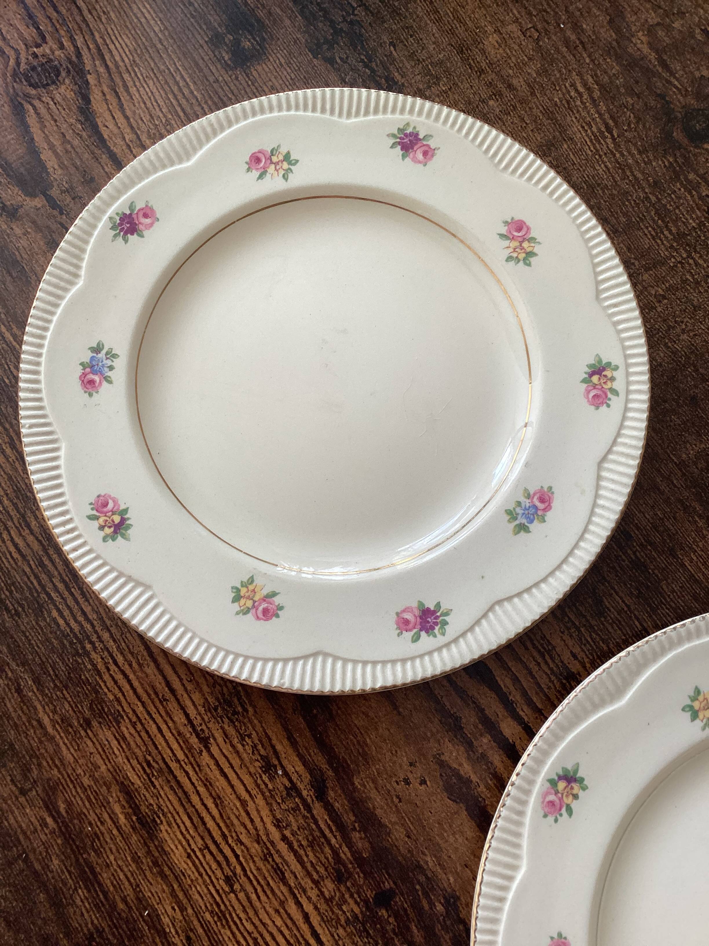 Two identical vintage Clarice Cliff plates from the Newport Pottery.