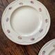 Two identical vintage Clarice Cliff plates from the Newport Pottery.