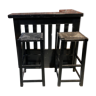 Bar set and its two blackened wooden stools.