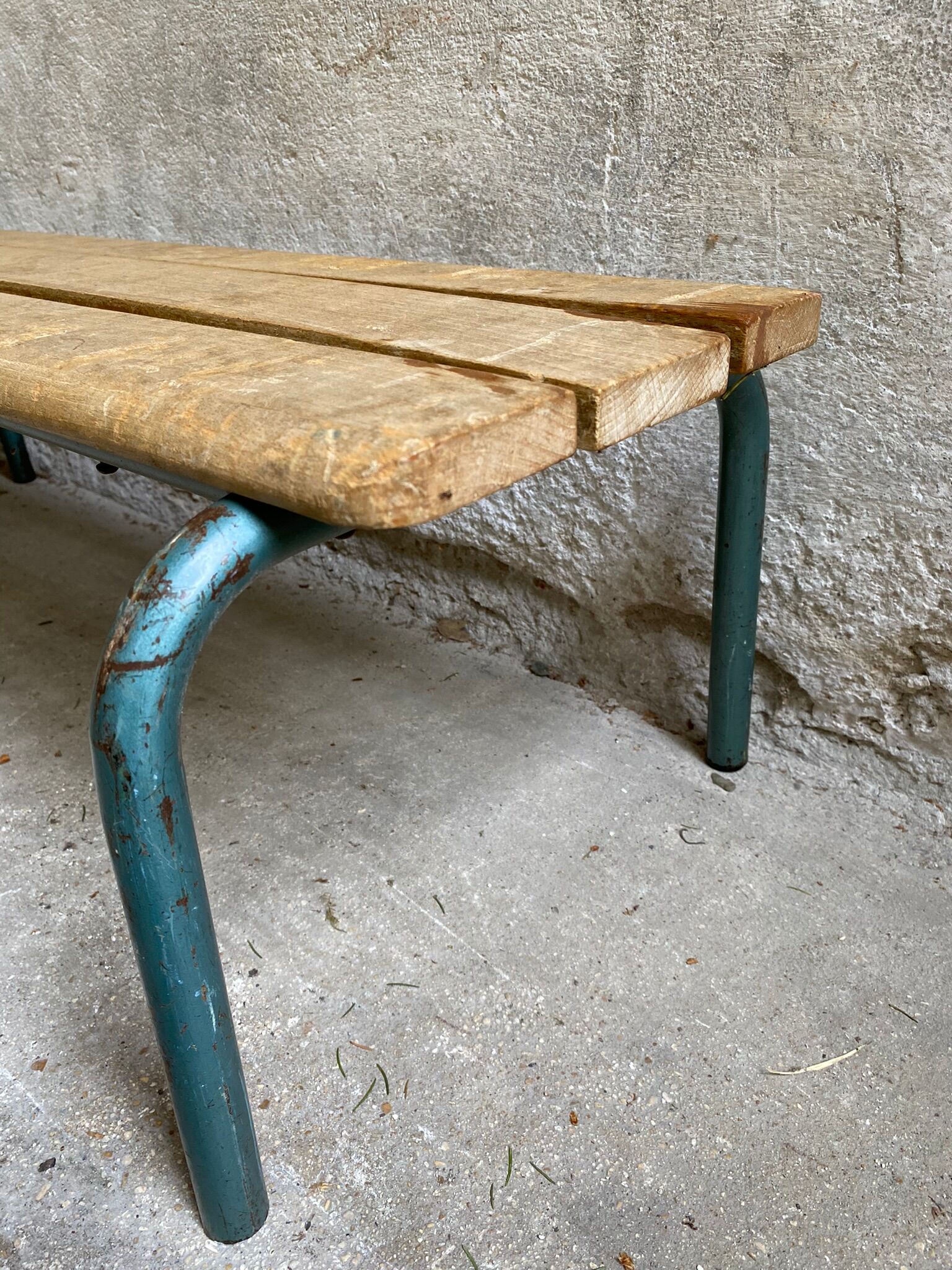 Vintage wood kindergarten bench and tubular structure in long